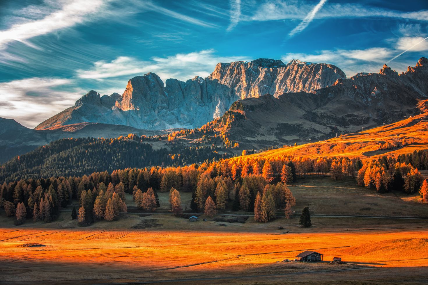 Aerial autumn sunrise scenery with yellow larches in Dolomite Alps