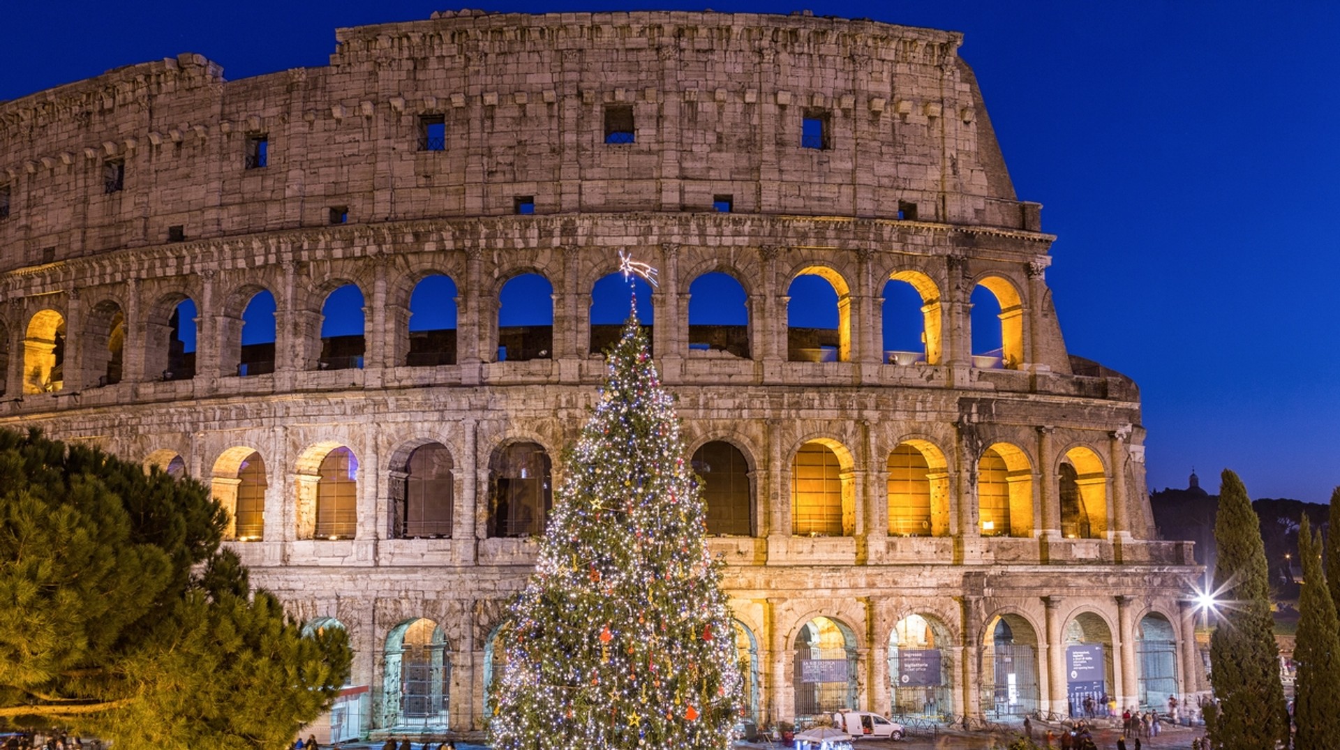 A stunning view of the Colosseum in Rome during Christmas Winter in Italy offers abundance of cultural sights, noticeable lack of crowds, vibrant café and bar scene, mild climate to ski adventures.