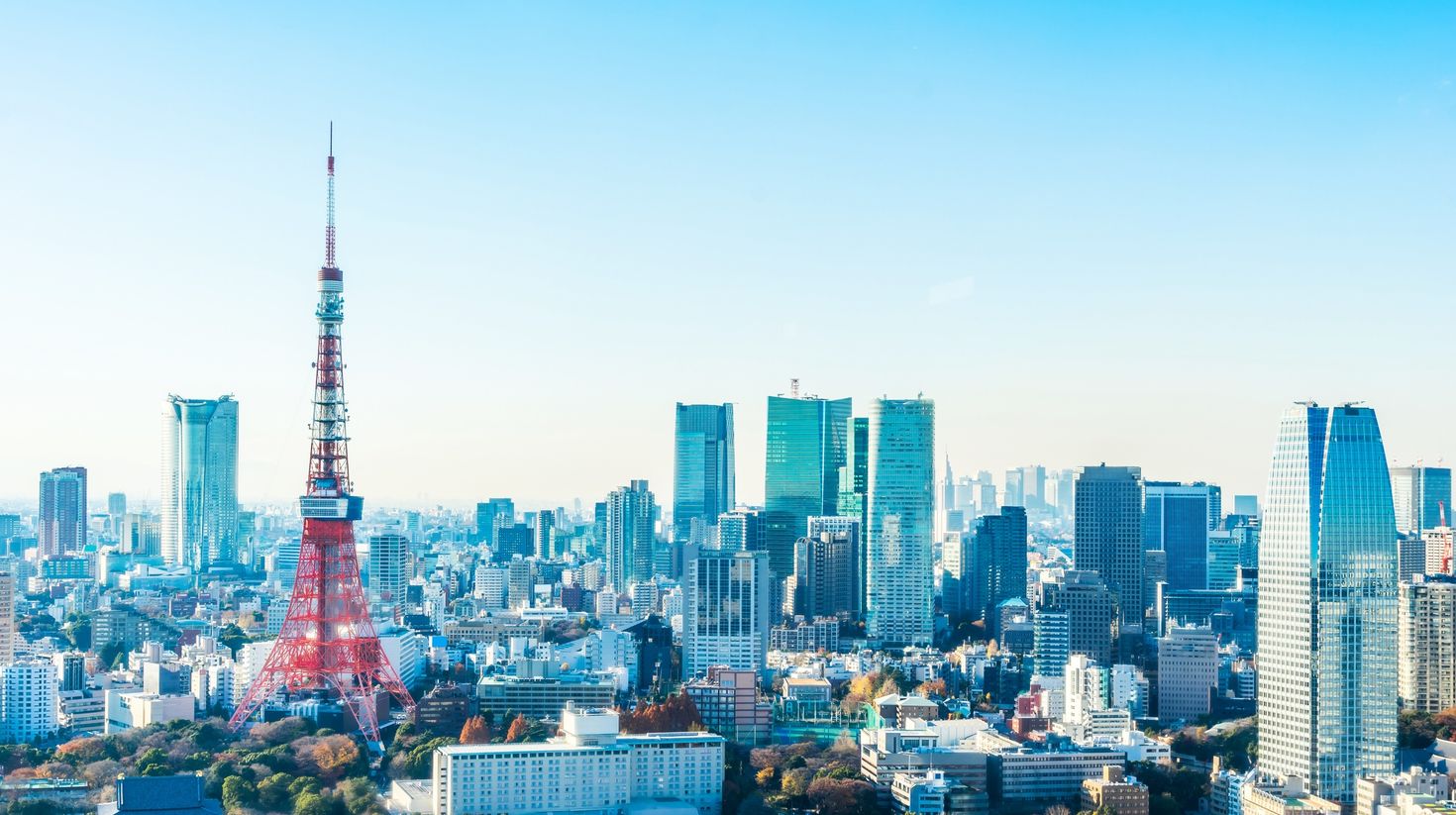 An aerial view of the Tokyo skyline during sunny weather in Japan.