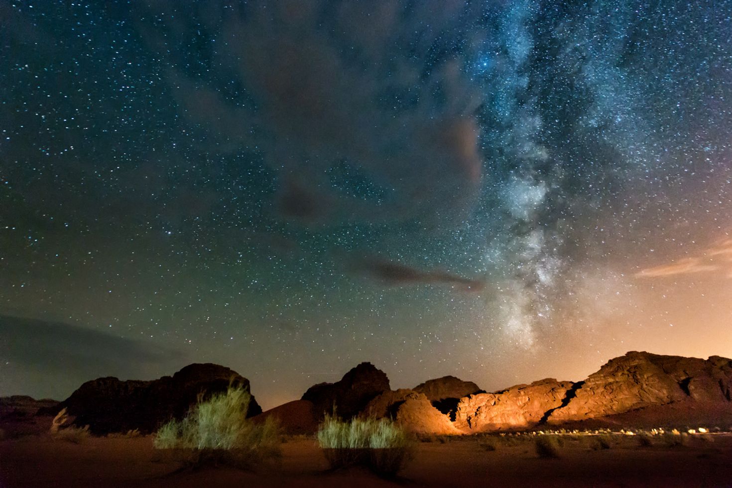 Milky way above the red Wadi Rum desert at night.