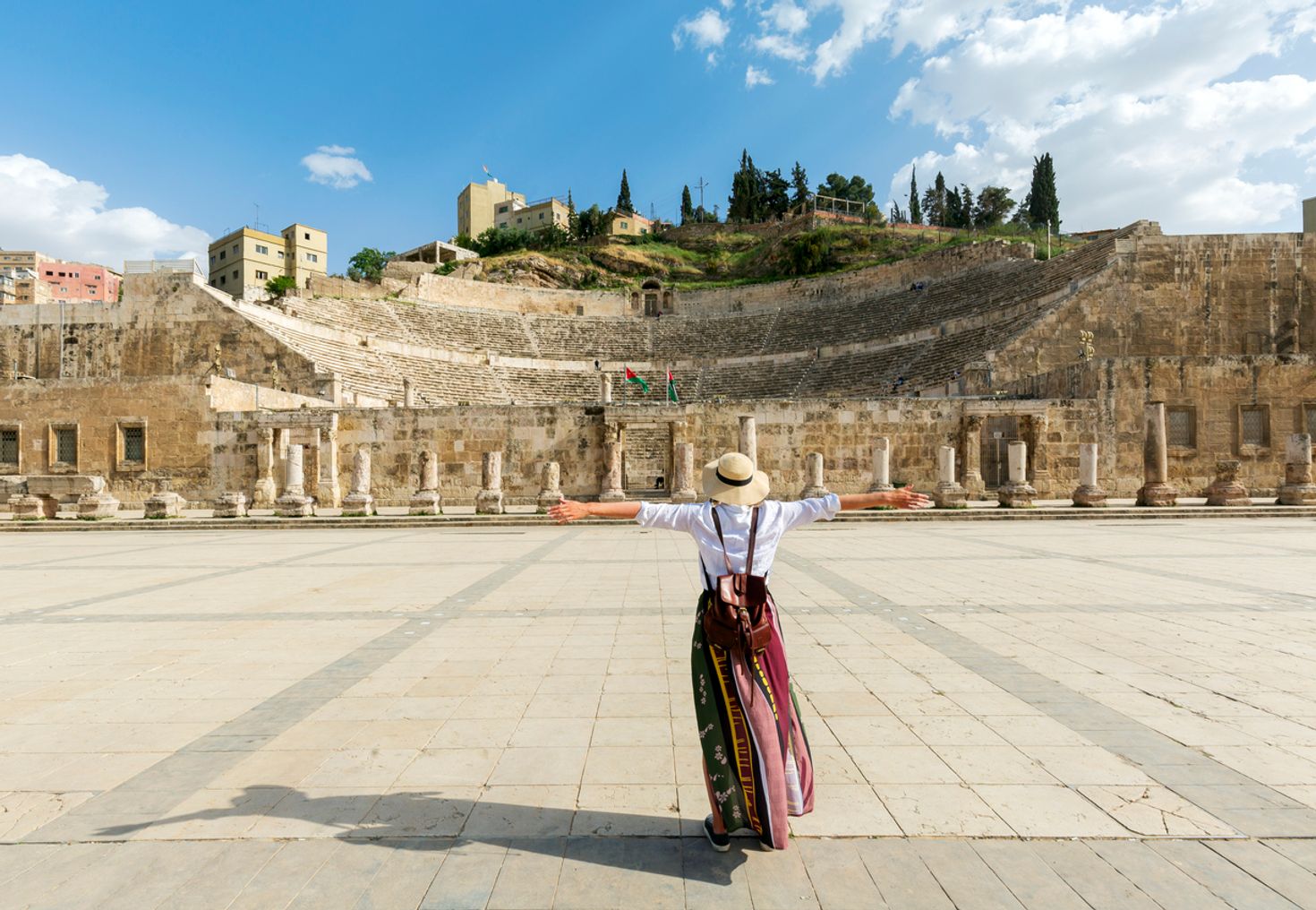 A girl enjoying the ancient city of Amman in Jordan during June.