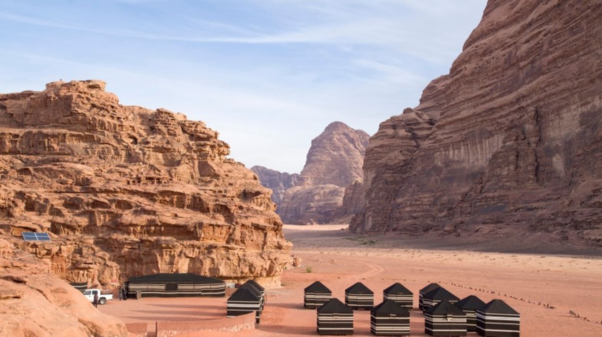 Camping in Jordan in March offers perfect weather and breathtaking desert views, making it a must-do experience. Camps in Wadi Rum on a clear day in Jordan in March.