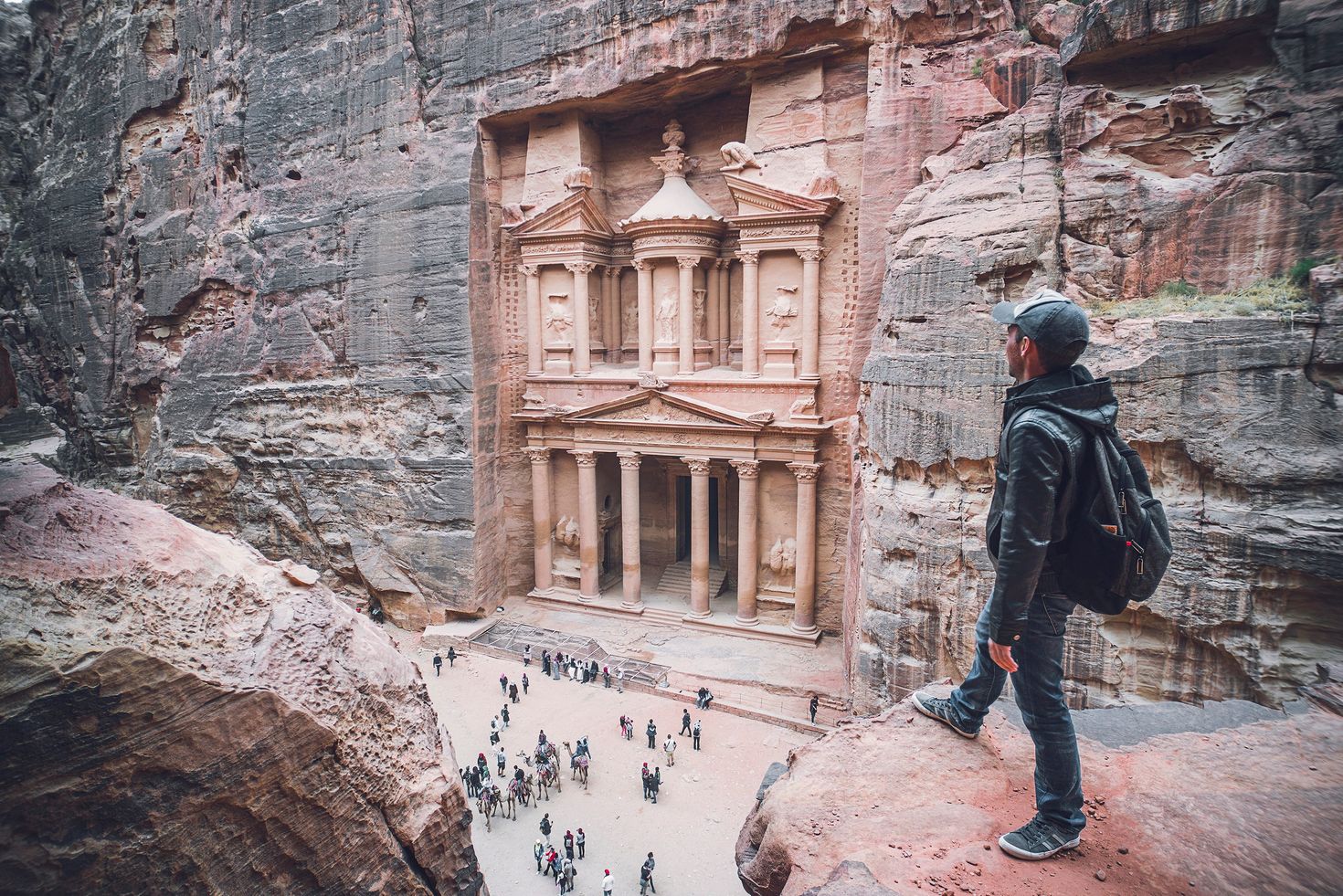 Women admiring the view of Jordanian desert while hiking in Petra.