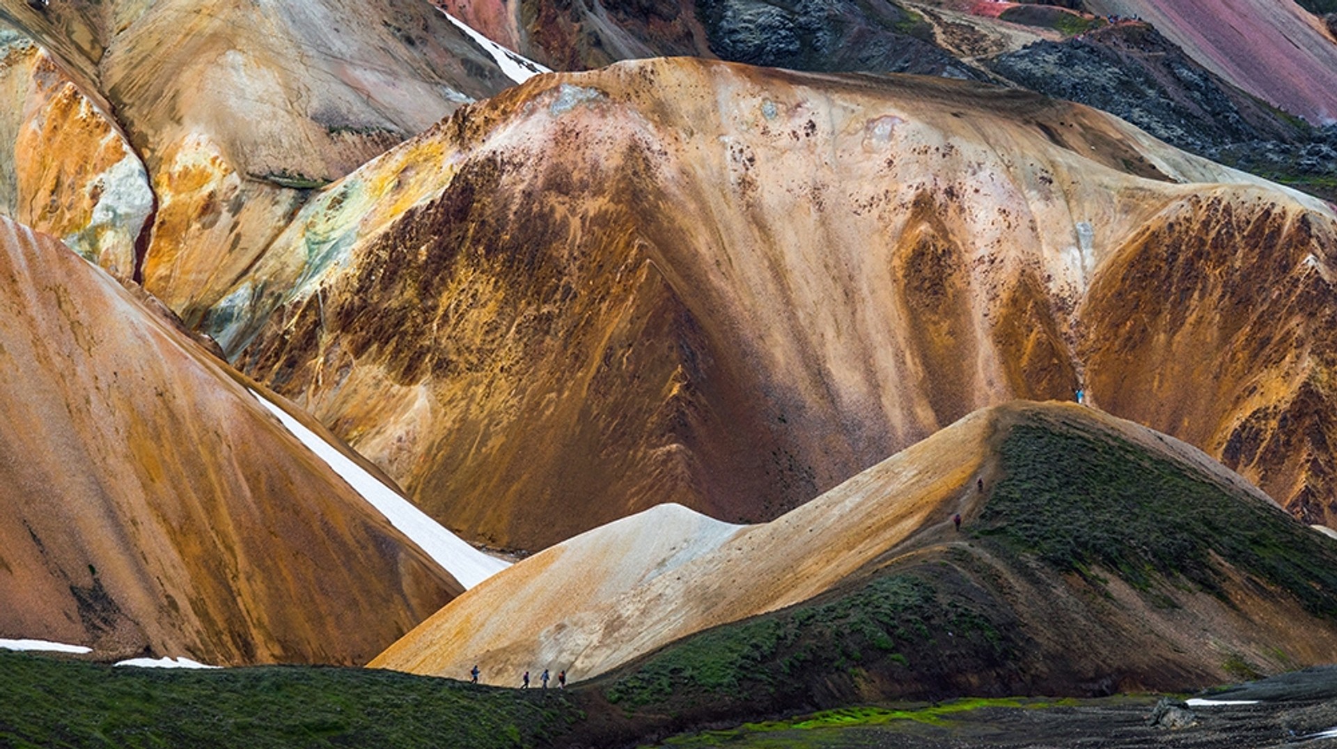 Hiking along the rugged landscape of Landmannalaugar in Iceland.