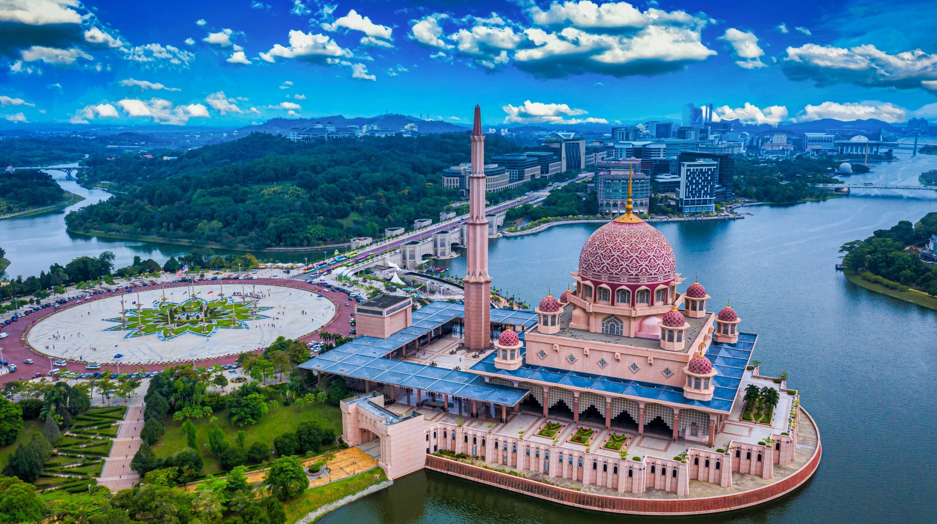 Influenced by the design of the Sheikh Omar Mosque, the Putra Mosque is one of the few pink mosques in the world. Aerial view of Putra Mosque in Malaysia in June.