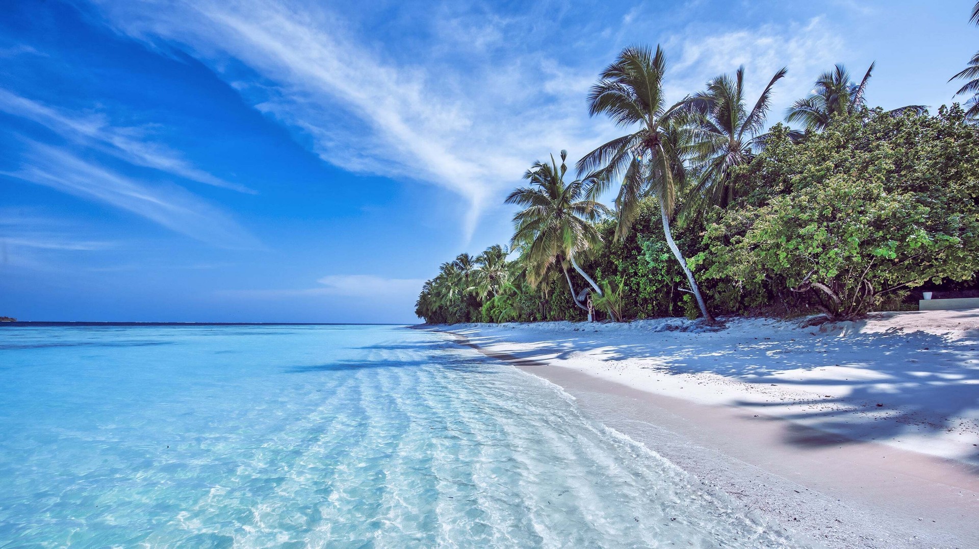 A tropical island on a warm sunny day in the Maldives in September.