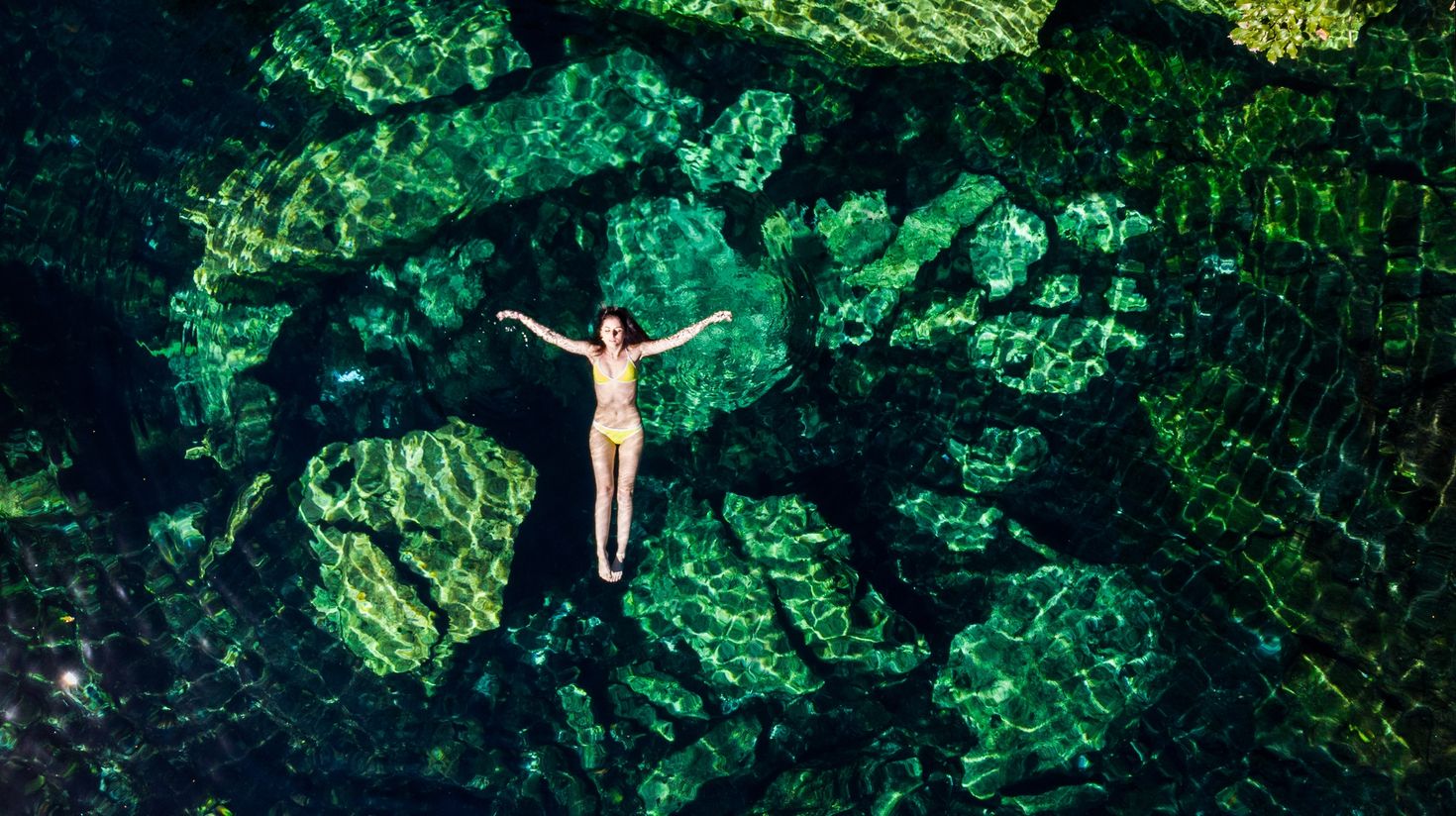Floating in the Cristalino cenote near Tulum, Mexico