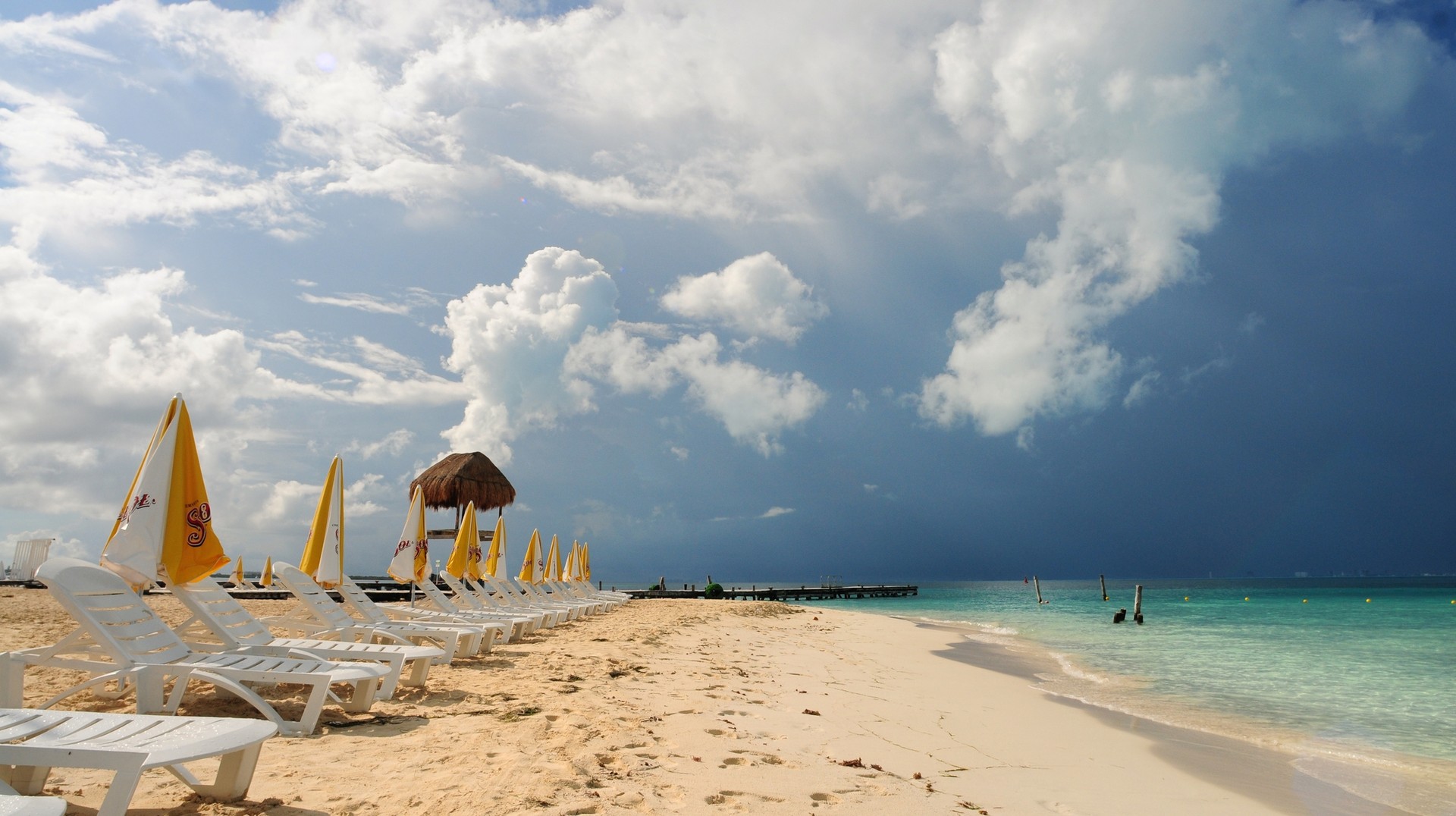 Mexico in July sees the peak of the rainy season in the country. However, the weather makes for a cool and relaxing trip during the summer. Beach Resort in the Caribbean during offseason period in Mexico in July.