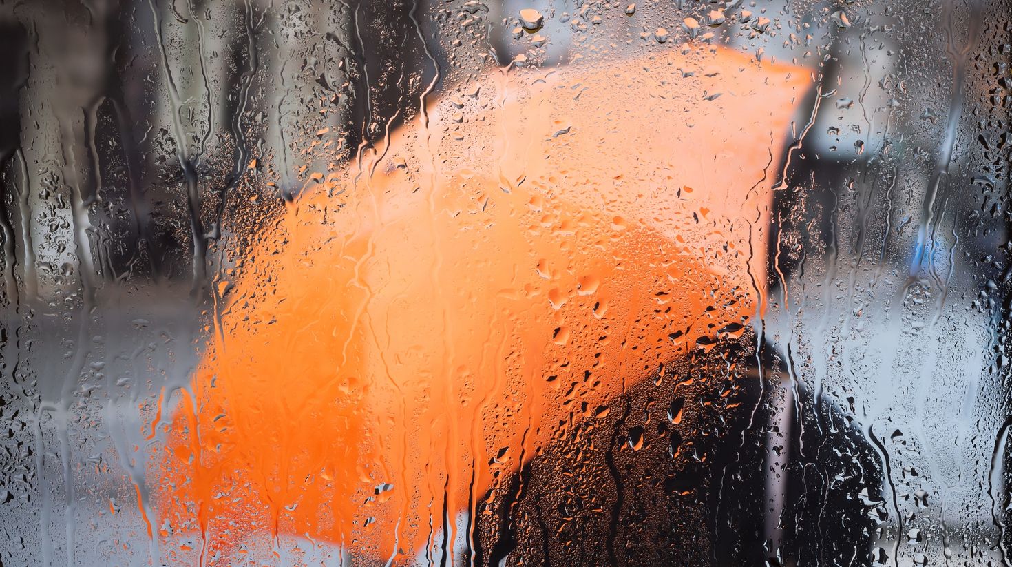 Rainy weather and raindrops on the glass