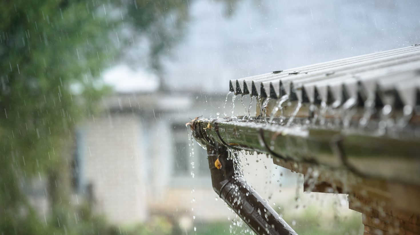 rain flows down from a roof down