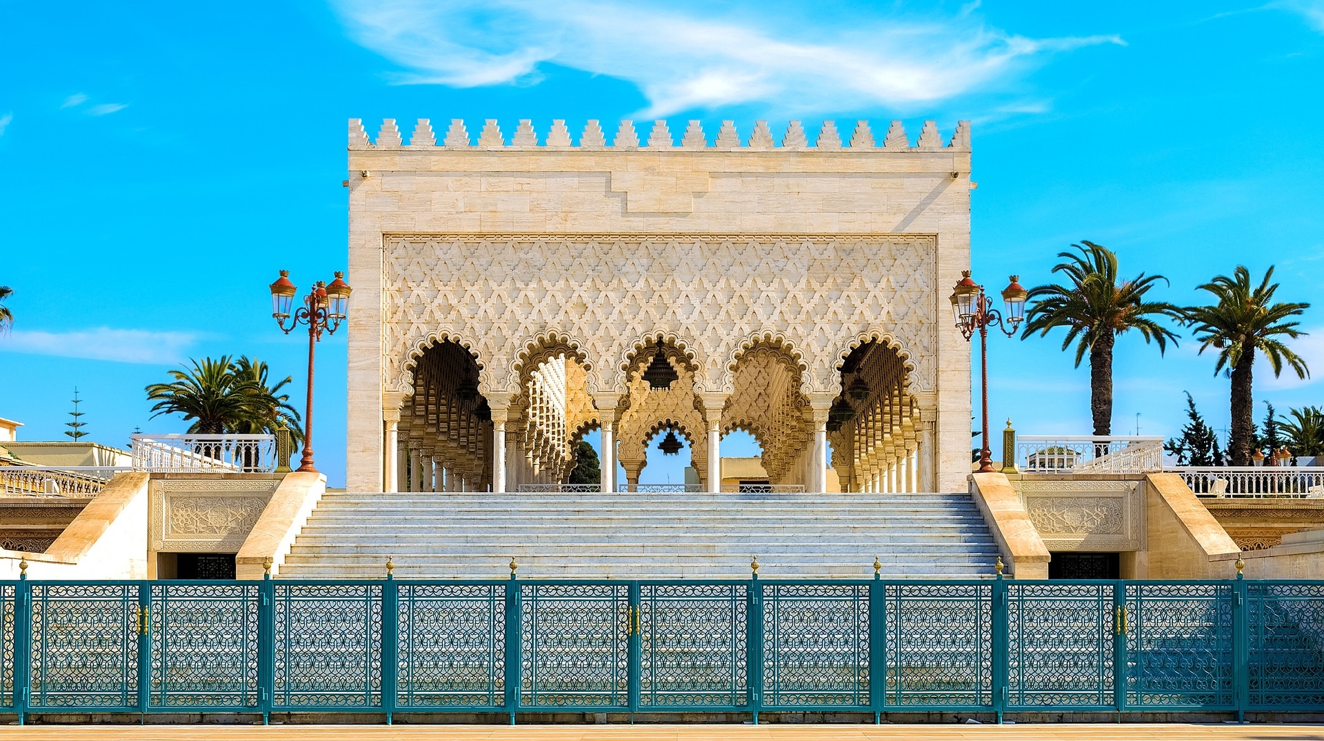 The mausoleum of Mohammed V is an architectural marvel of the Alaouite dynasty and the resting place of the Moroccan empire and his sons. Snow white Mausoleum of Mohammed V against the blue sky, Rabat, Morocco
