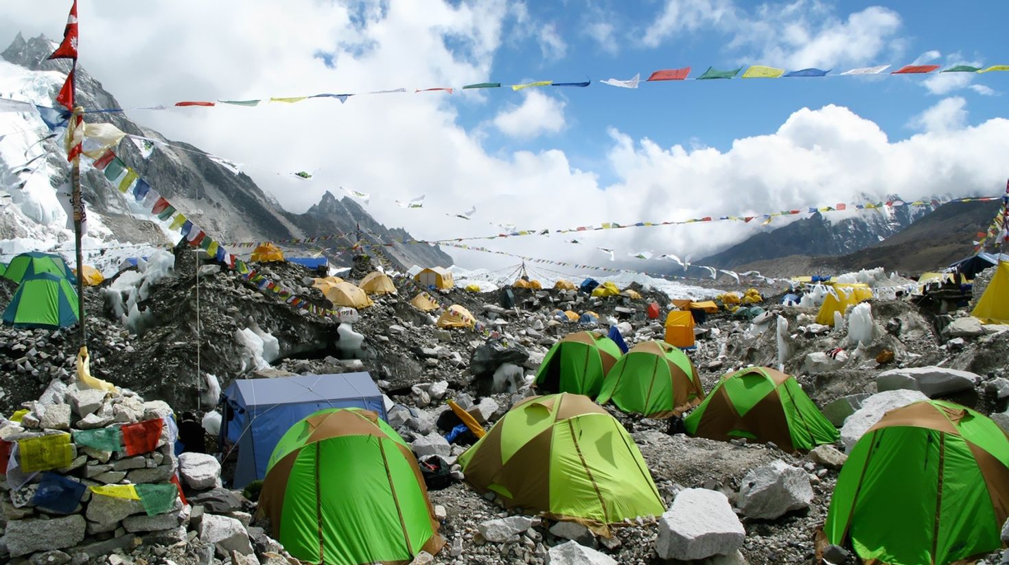 Go camping in the mountains in Nepal in October.