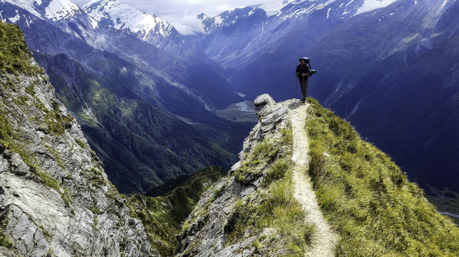 Walk on the edge of cliffs during hikes in New Zealand.