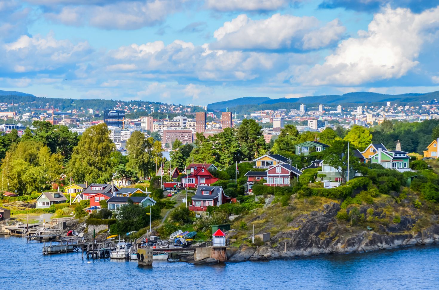 The aerial of view of Oslo between the city and typical Nordic cottage