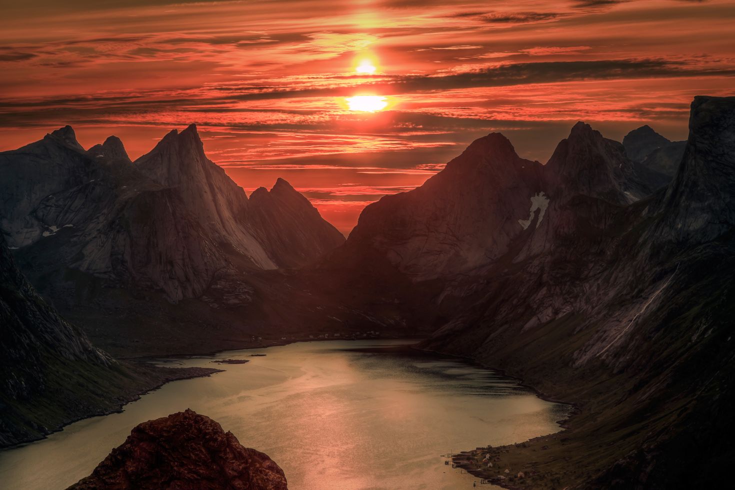 Midnight sun over Reinebringen - summer in Lofoten in Norway