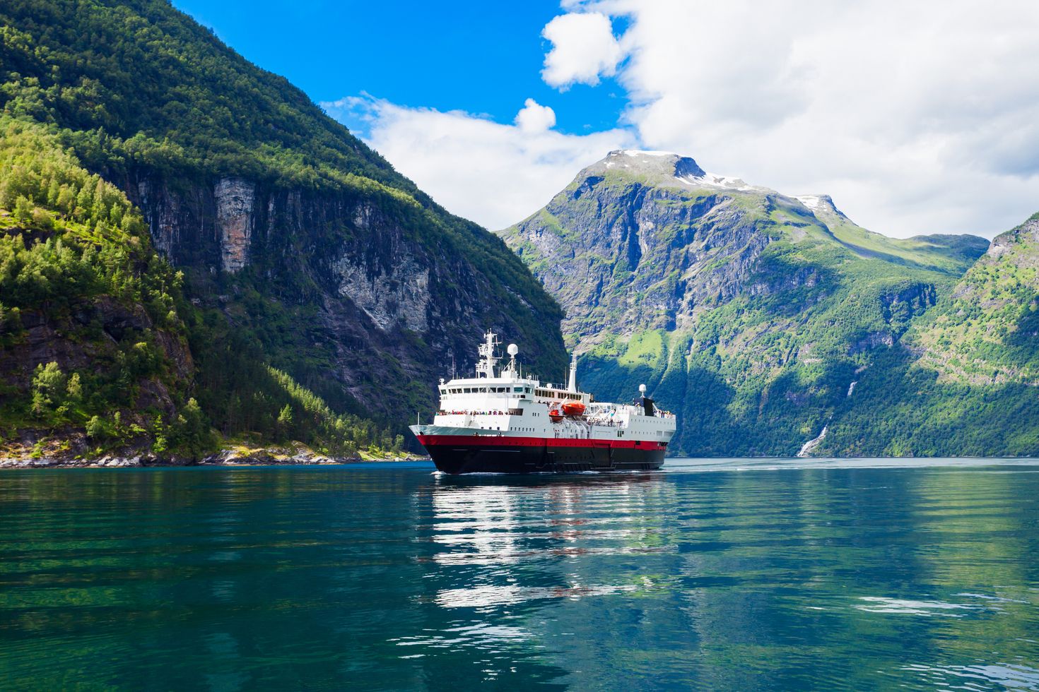 Tourist boat cruising at Geirangerfjord, Norway