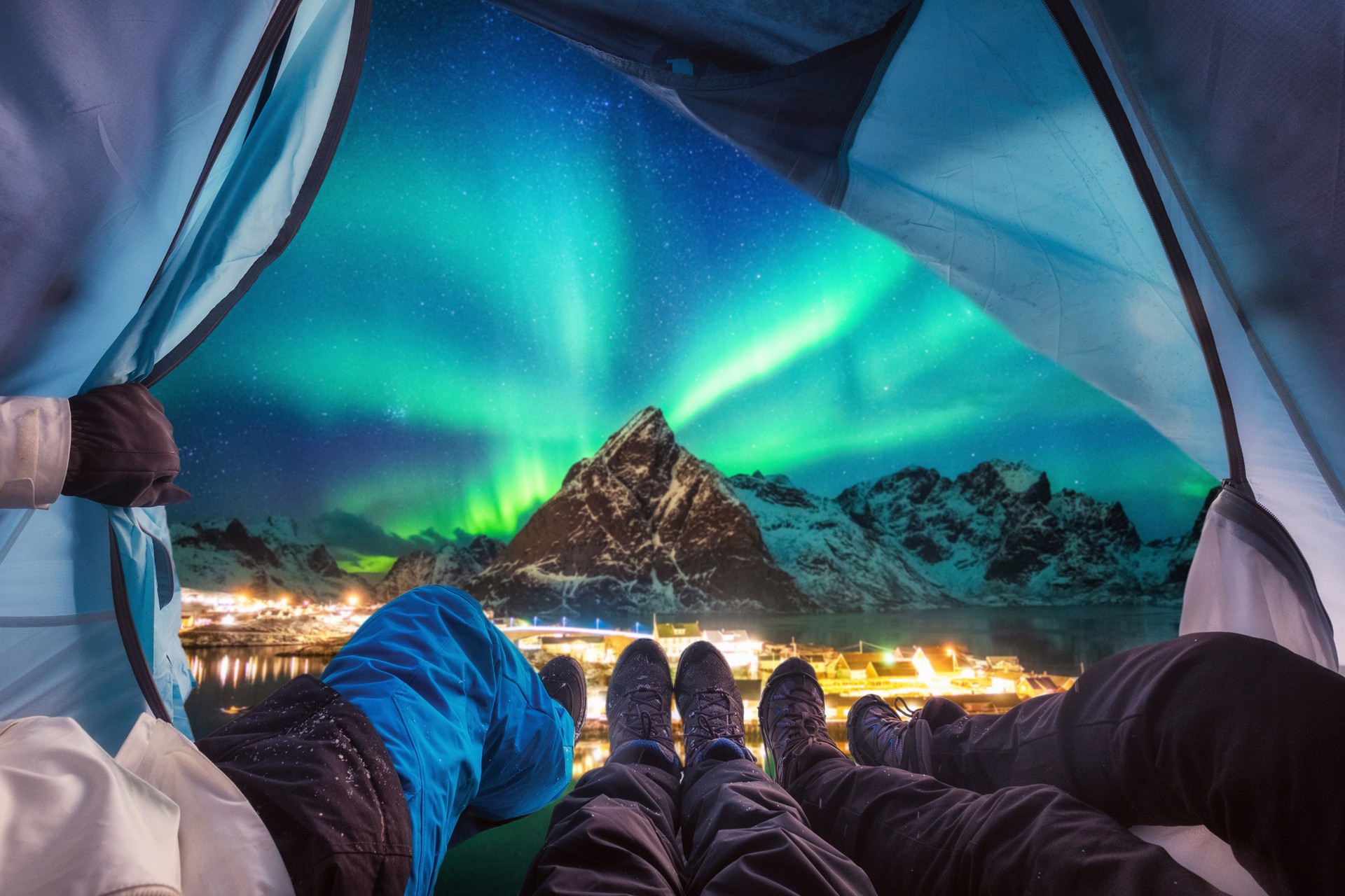 Camp at different northern light site to explore the mysterious yet beautiful phenomena of aurora borealis in November View of Aurora borealis from a trekker's tent, Norway in November