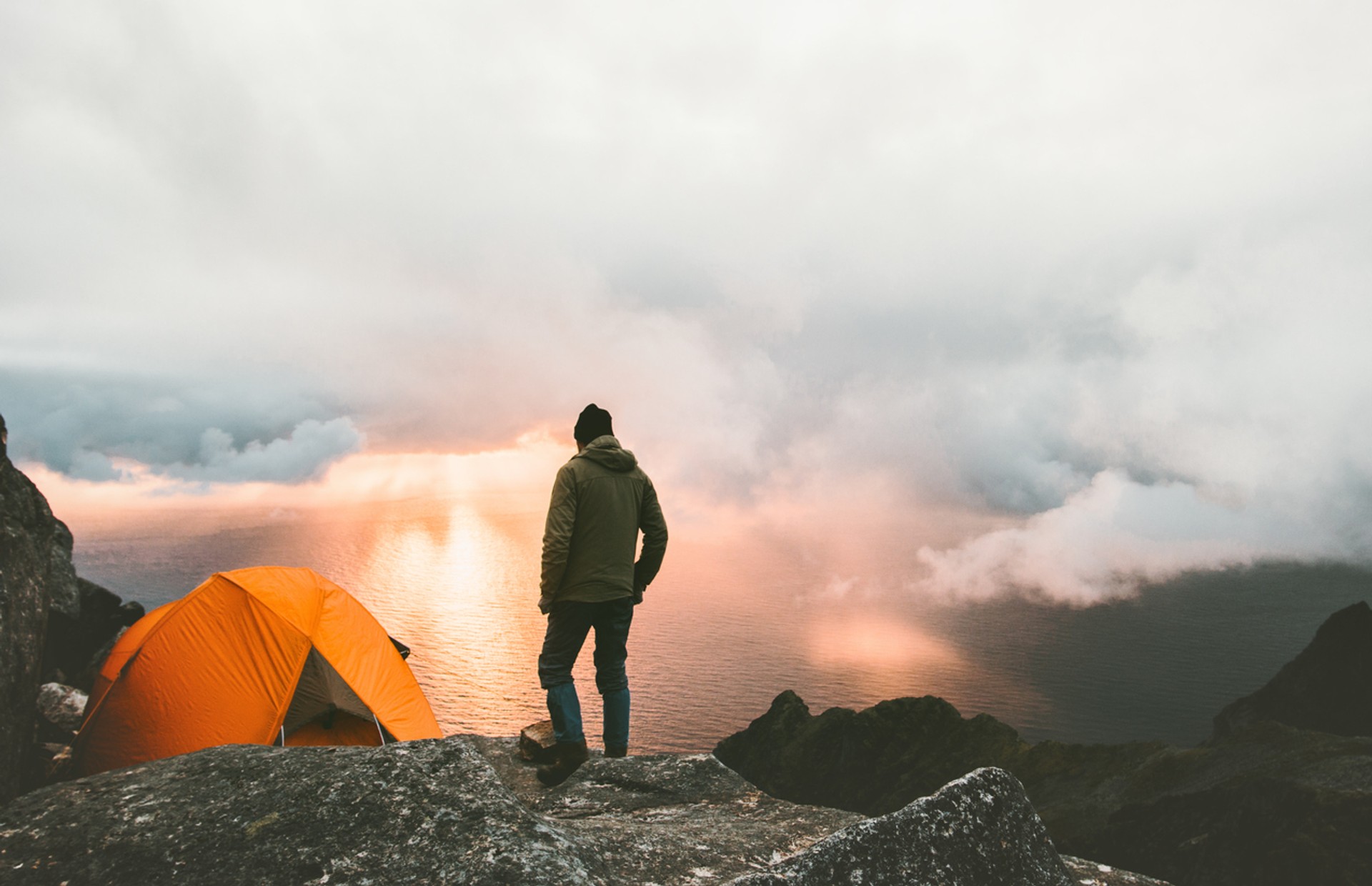 Norway can be a great place for camping. Find your adventure on your trip to Norway this October A man looking over a camp site in Norway in October