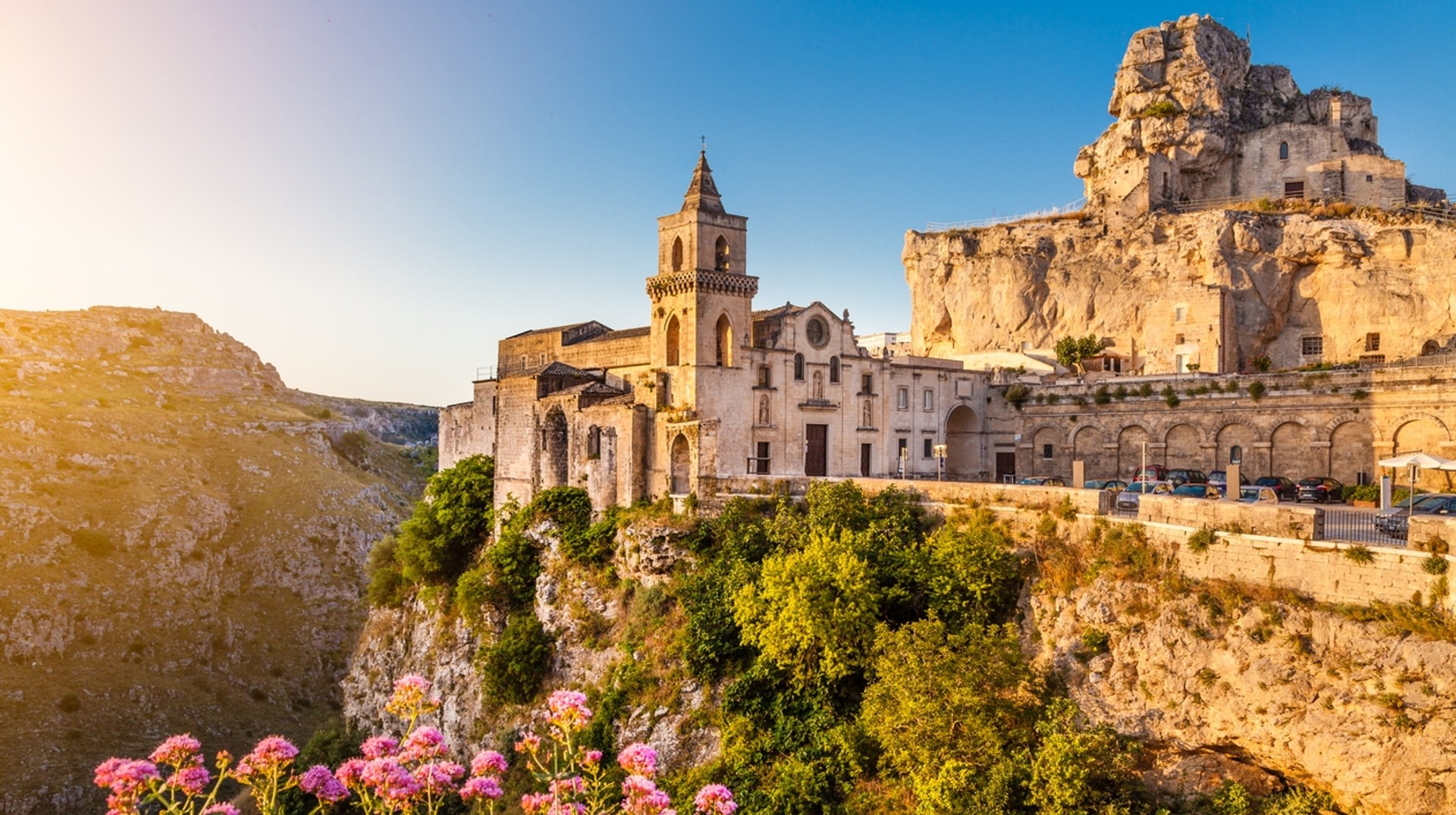 These houses carved out of rocks in Matera are splendid to explore The rocky cliff-side of Matera is clustered with old houses perched on top.