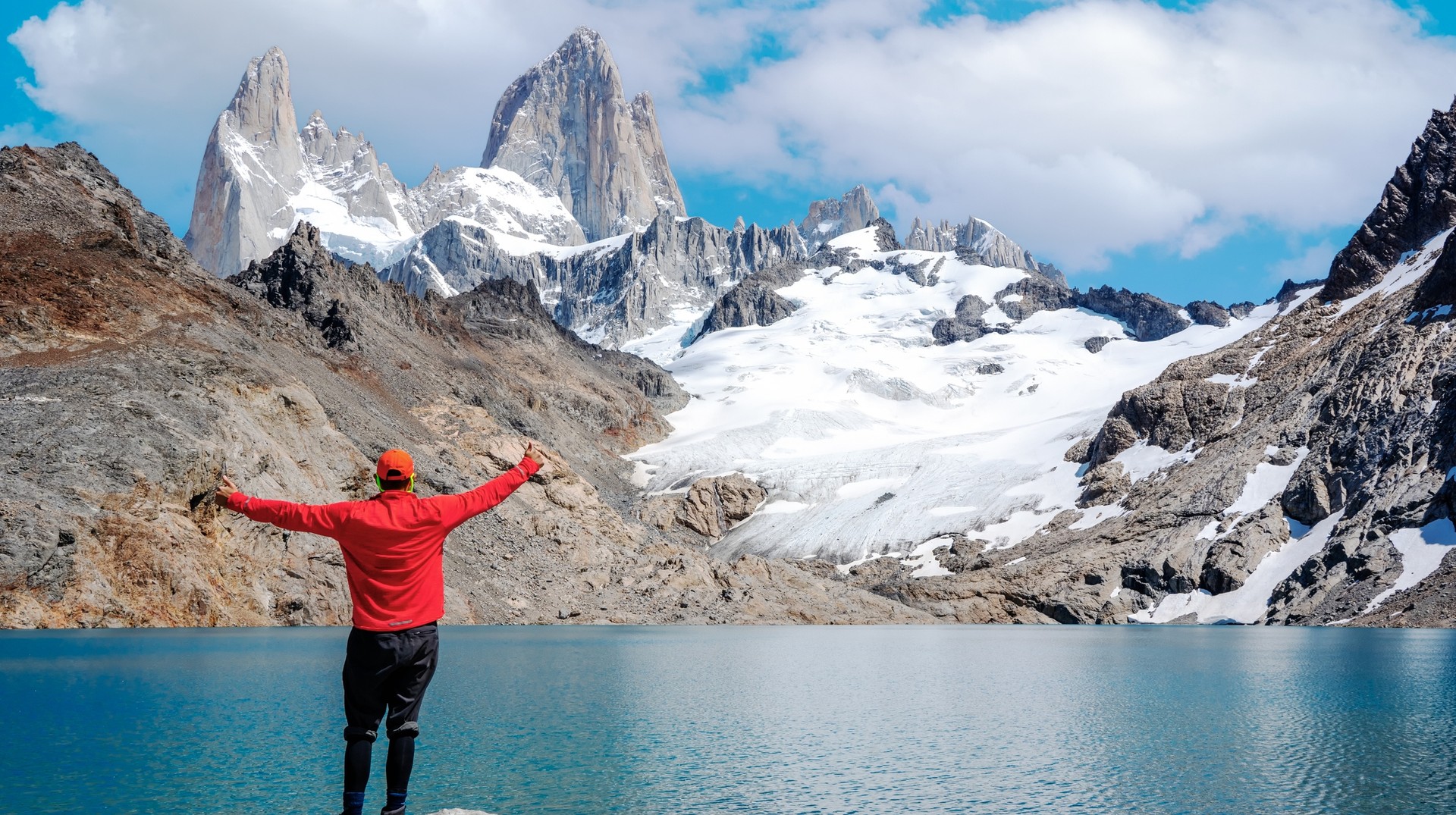 Experience beauty and the winter breeze at Mt. Fitz in Patagonia during August. A young man enjoying the view of Mt. Fitz in Patagonia in August.