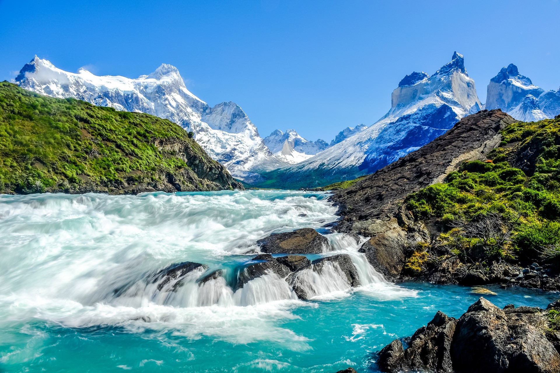 Patagonia in December offers the ideal combination of sunlight, comfortable weather, and longer daylight hours for nonstop outdoor pleasure. Beautiful landscape photo and waterfall with Andes Mountain in Patagonia in December.