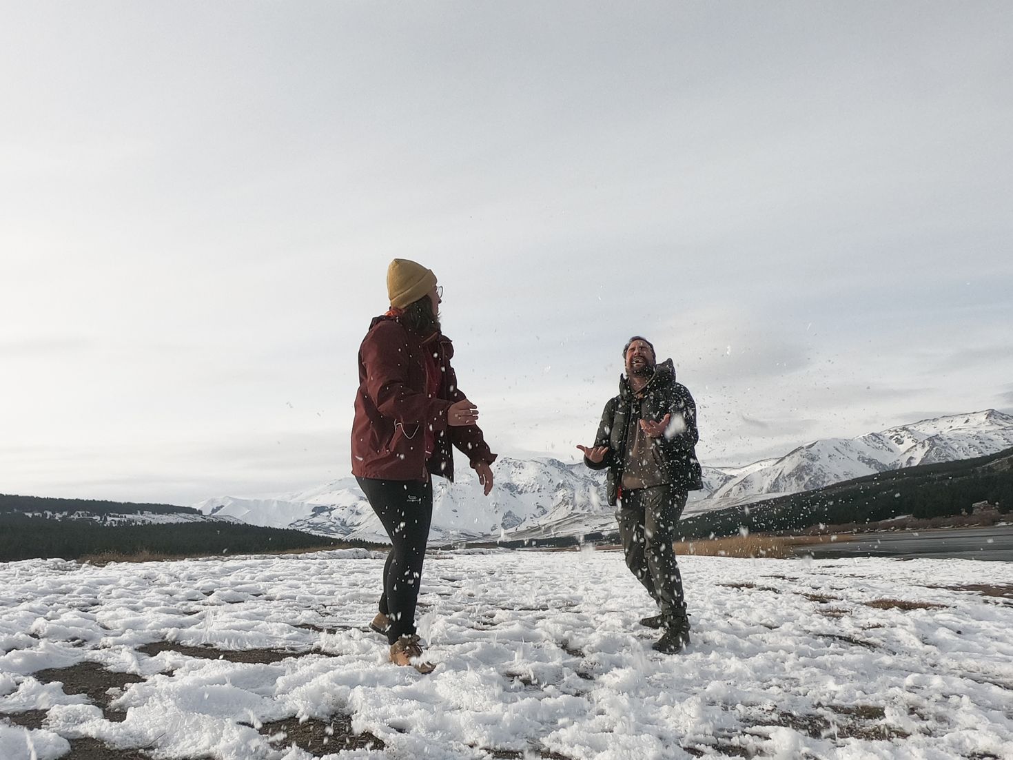Two people enjoying with snow in Patagonia during June.