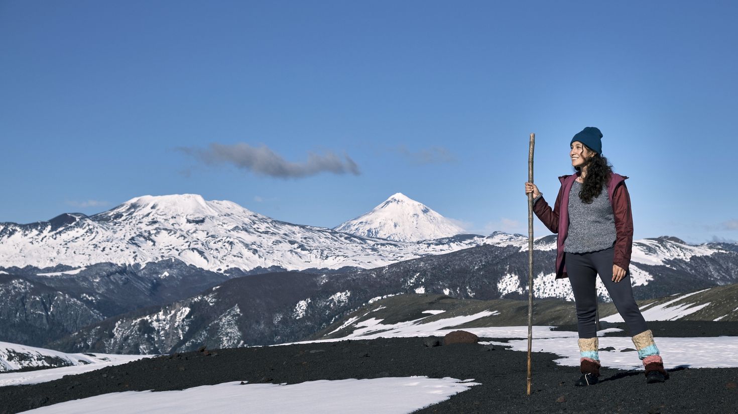 A woman enjoys the scenery after her hike in National Park of Patagonia.