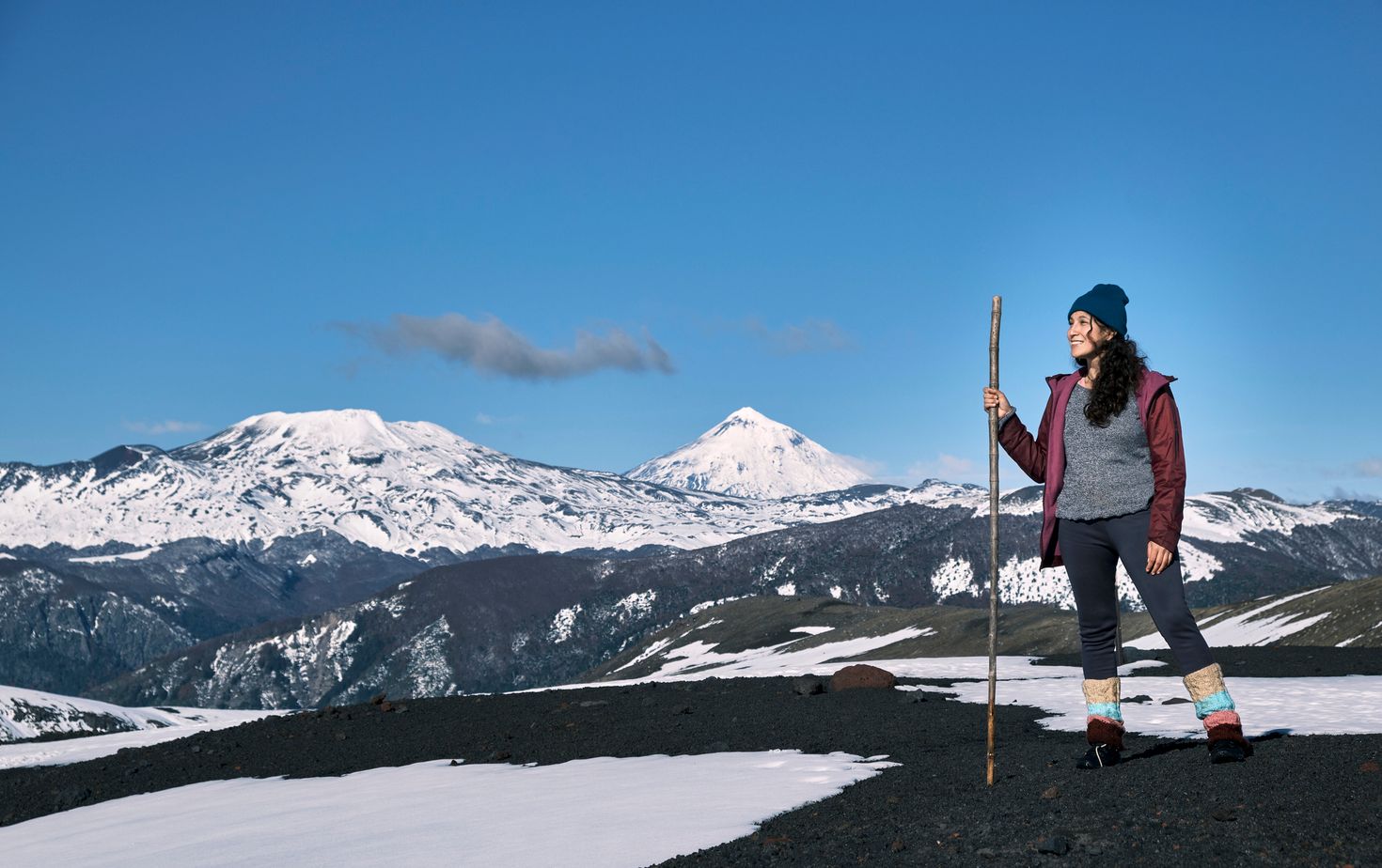 A woman at the top enjoying the scenic view.