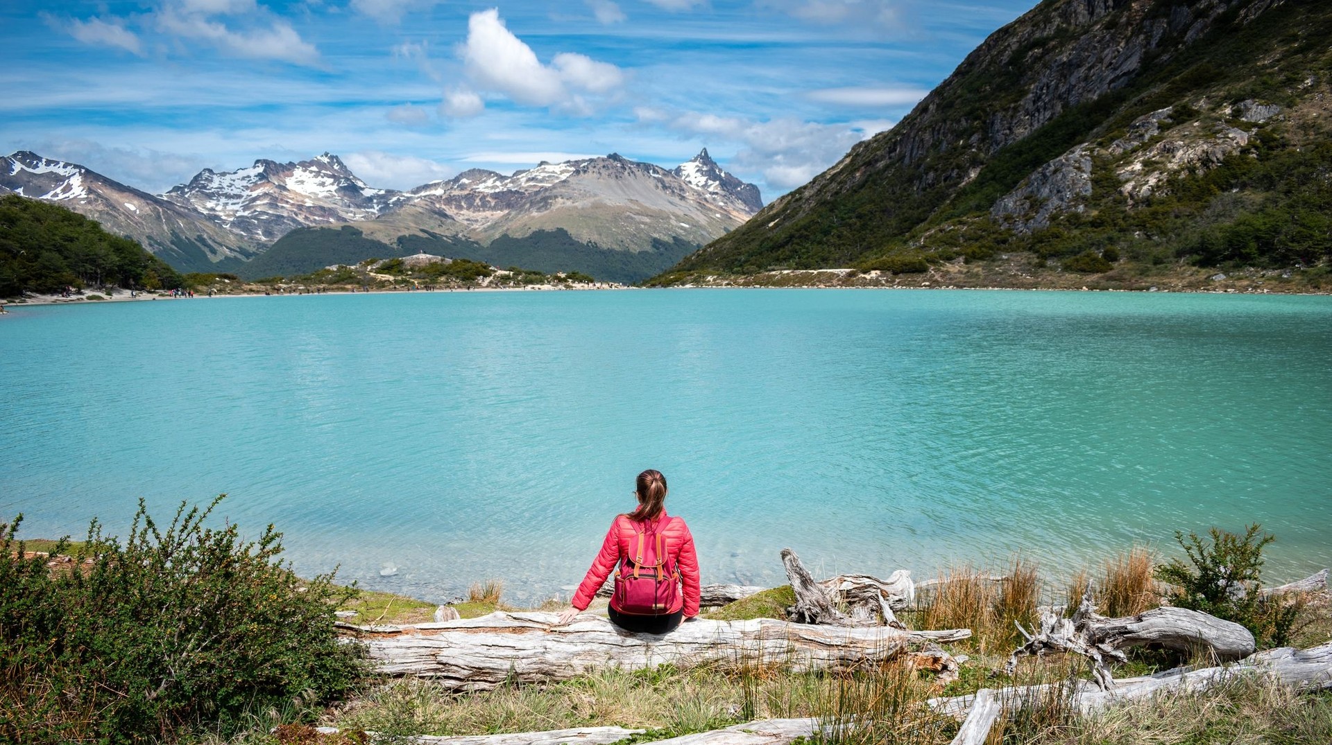 Discover the southernmost city in the world, Ushuaia, and let its stunning landscapes and vibrant culture captivate you during your one week in Patagonia. A young tourist enjoying the scenic view in Ushuaia during her one week in Patagonia.