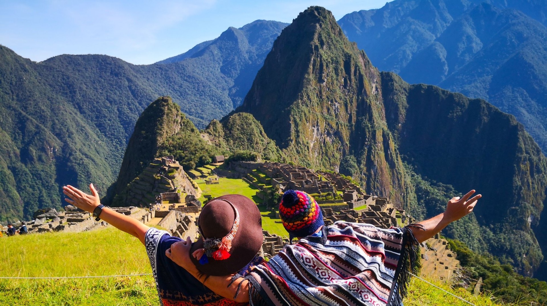 Hike the Machu Picchu mountain with your love ones to uncover ancient Inca history when spending 12 days in Peru. Couples admire Machu Picchu mountain as they spent 12 days in Peru.