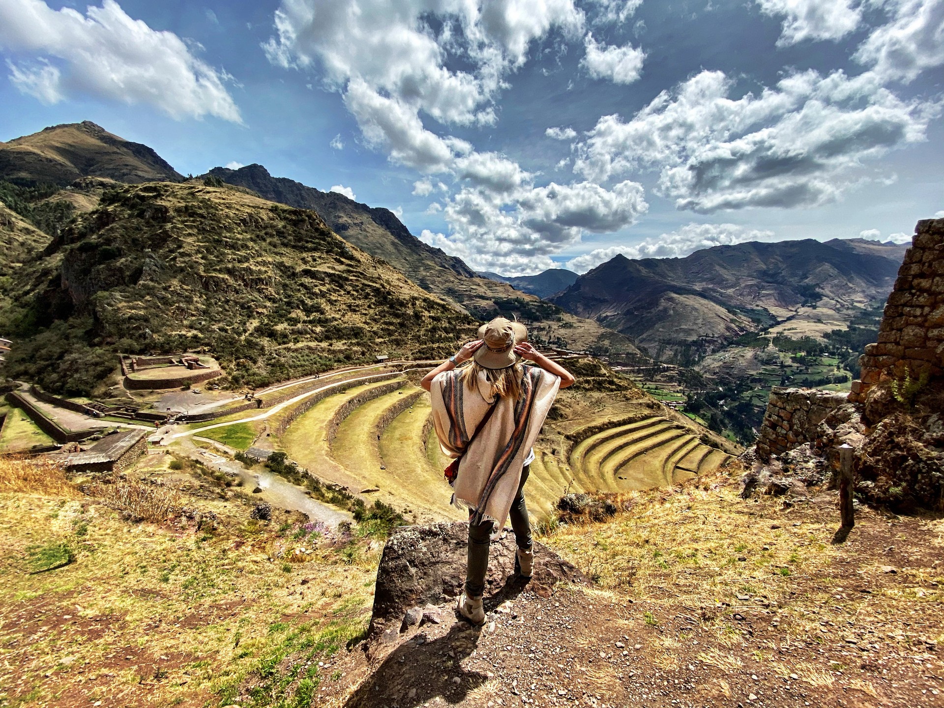 A woman admiring the beauty of Sacred Valley during her 8 days in Peru.