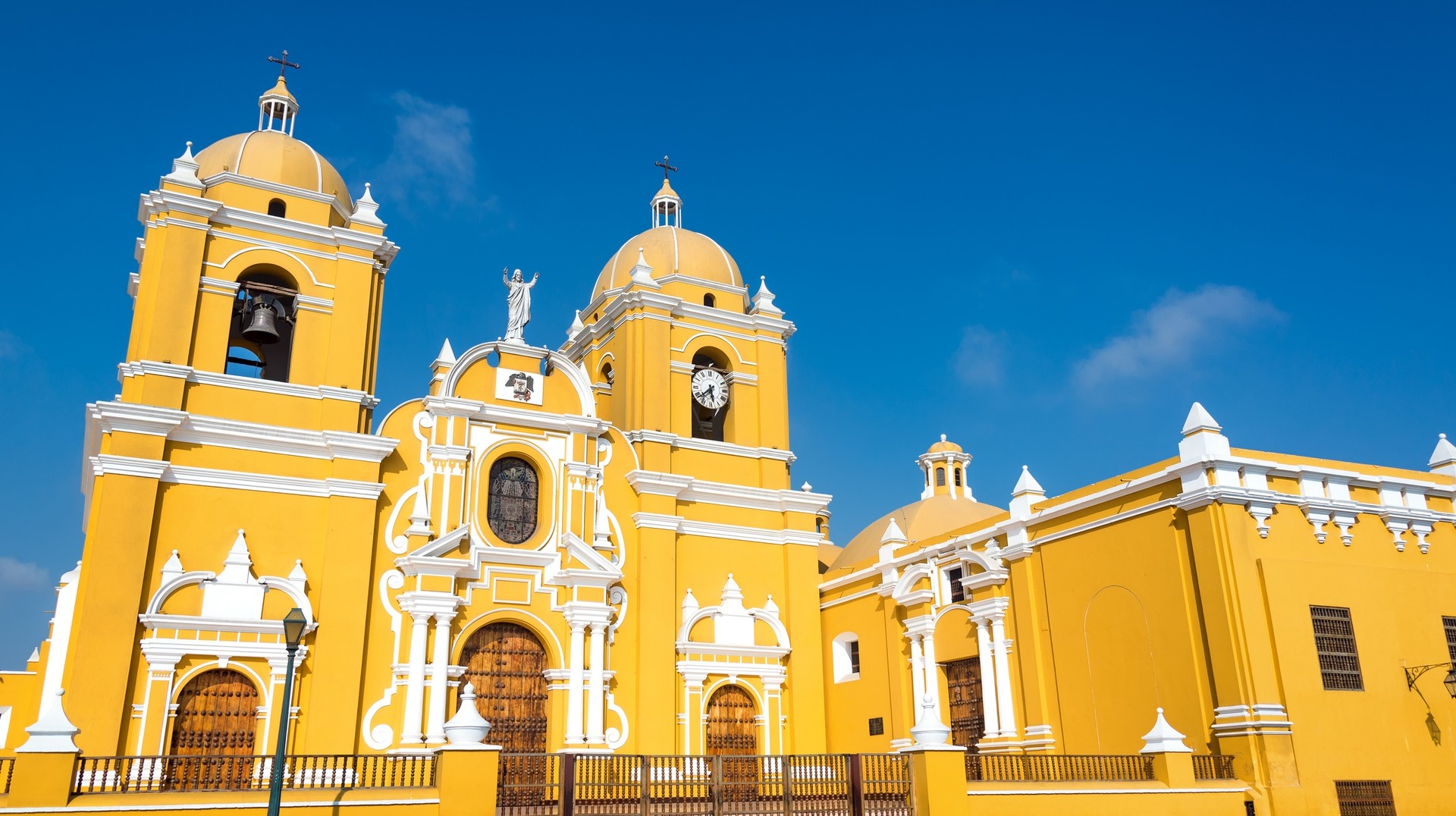 Trujillo is known for its unique attractions and rich cultural heritage. Magnificent yellow cathedral with a beautiful blue sky in Trujillo, Peru in August