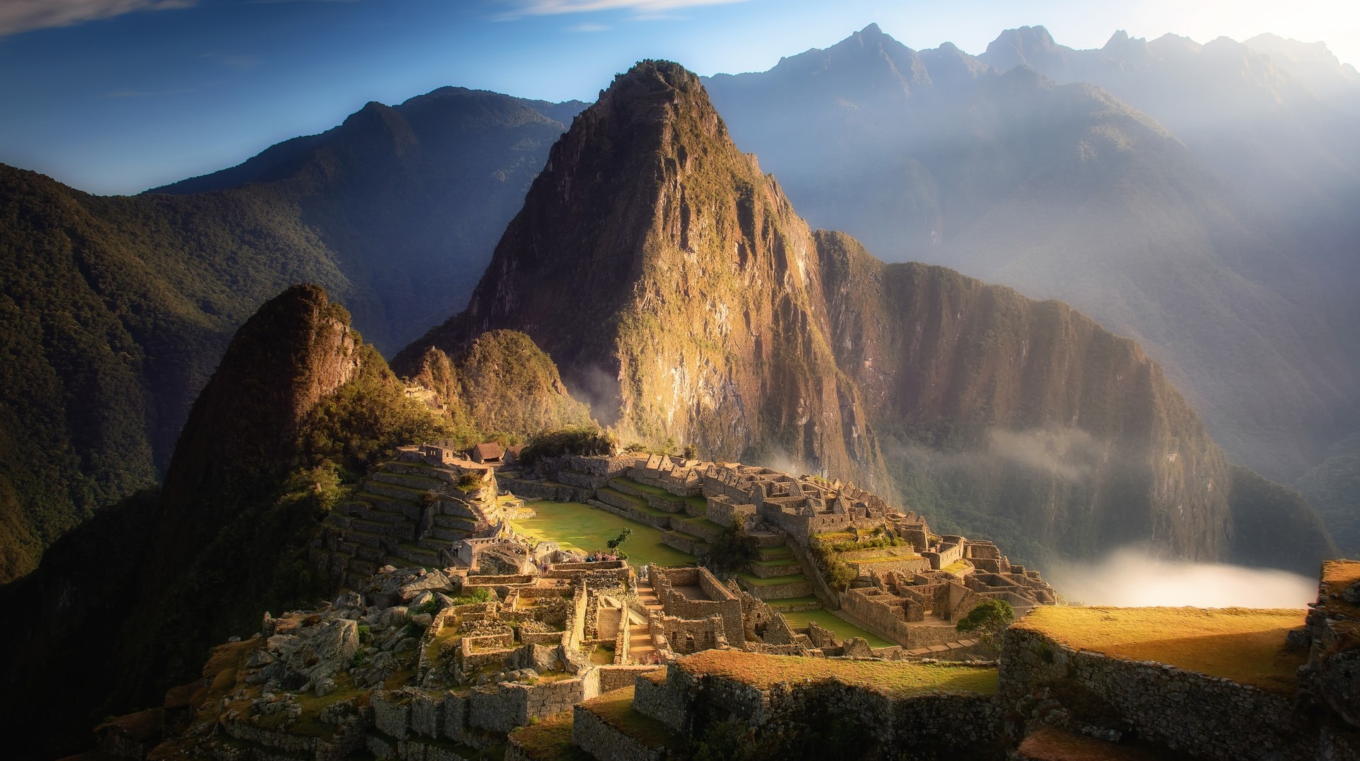 Visitors frequent Machu Pichhu to visit the ancient archeological site in the Sacred District. Sunrise over Machu Picchu Mountain, Peru in September