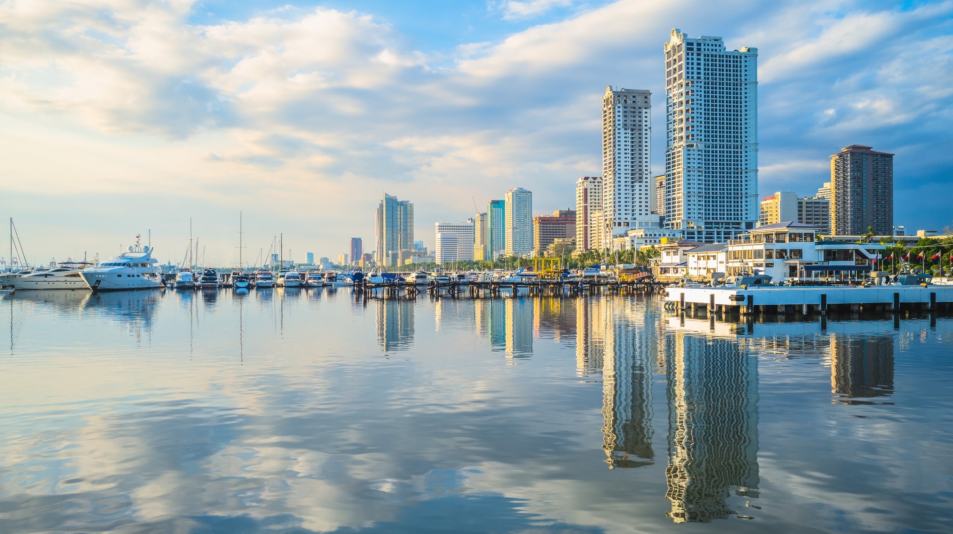 Visit the Philippines in February for picture perfect views. Port of Manila at Manila Bay in the Philippines in February.