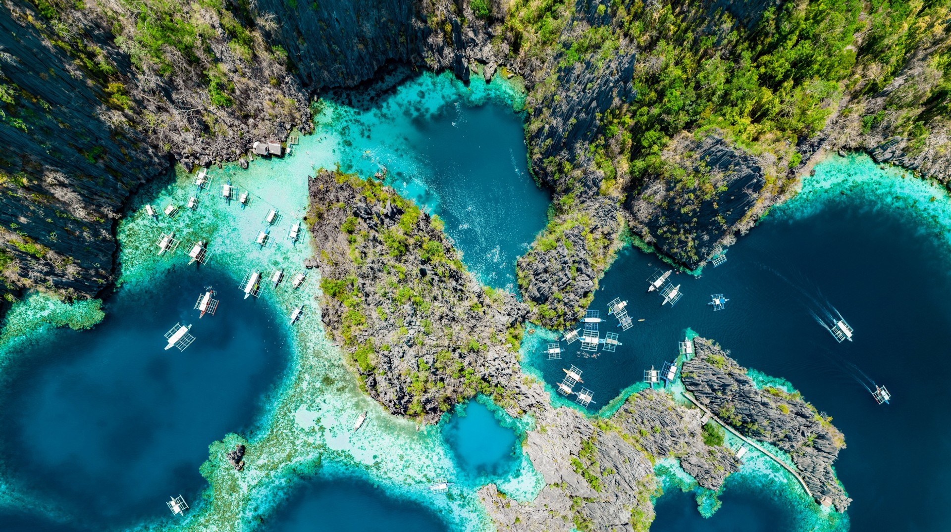 Enjoy hiking, snorkeling and scuba diving in the northern Palawan, Coron Island during your 8 days in the Philippines. Aerial view of Coron Island and its deep blue waters during your 8 days in the Philippines.