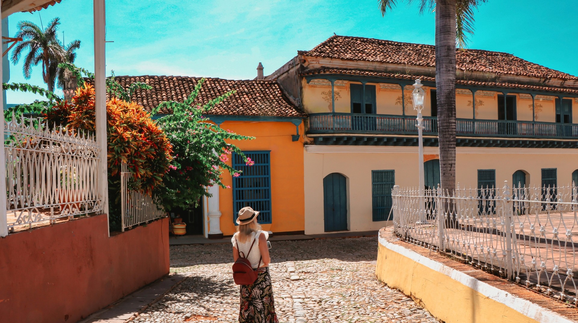 Embark on an unforgettable journey through Trinidad in Cuba, one of the top places to visit in Cuba, and immerse yourself in its rich history and stunning landscapes A young tourist exploring Trinidad, which is one of the best places to visit in Cuba.