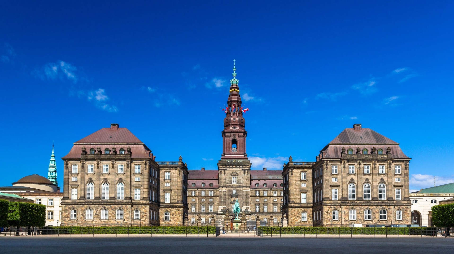Discover Christiansborg Palace, places to visit in Denmark, where royal history and architectural grandeur converge in the heart of Copenhagen. Christiansborg Palace in Copenhagen which is one of the top places to visit in Denmark on a clear day.