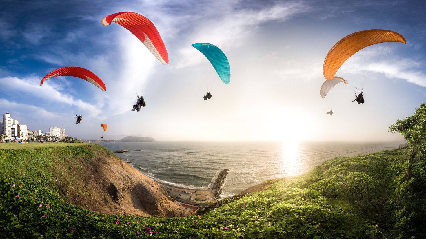 Enjoy paragliding like these people while touring Peru.