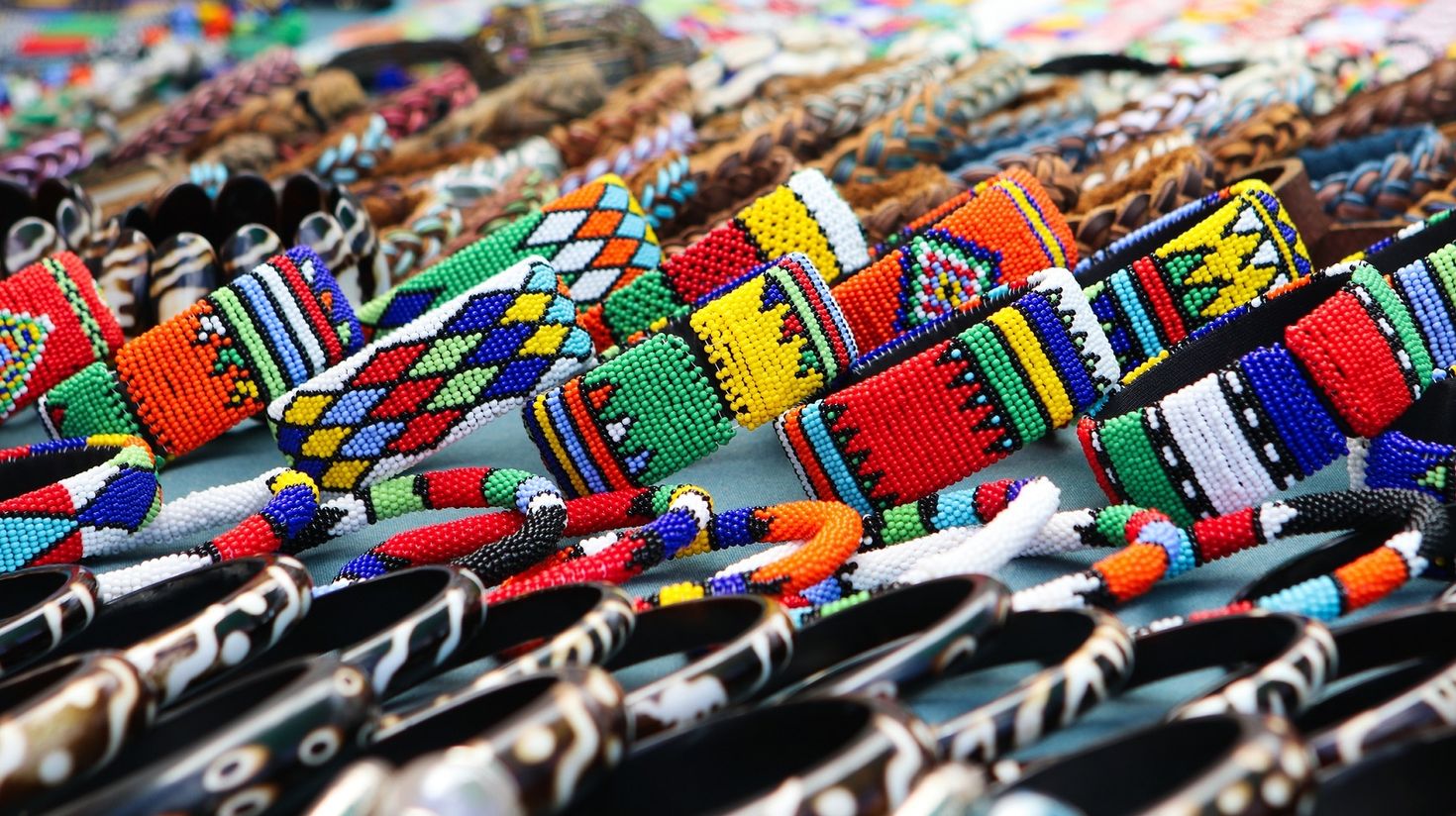 Colorful handmade bracelets, bangles at local craft market in South Africa