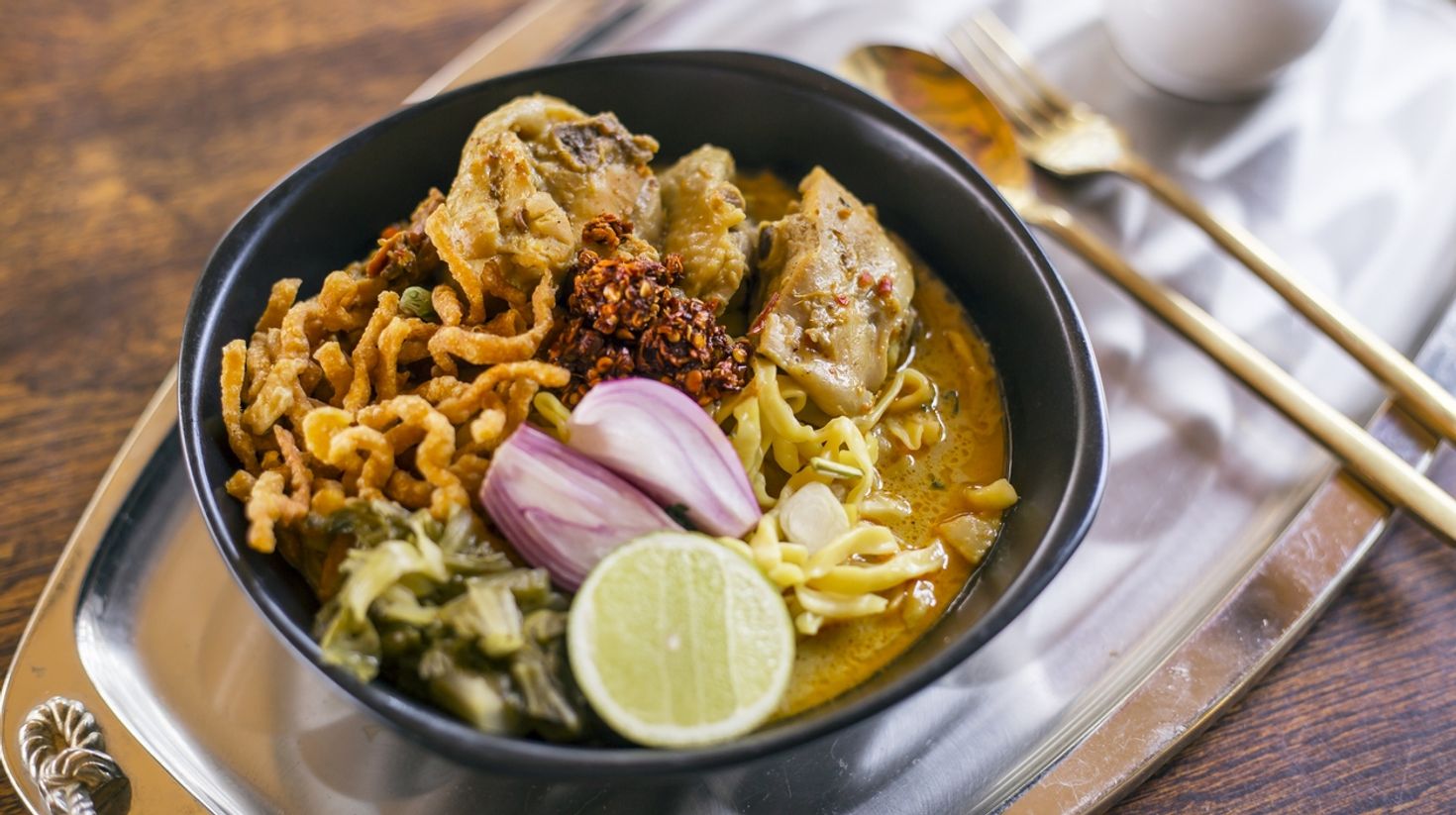 Have the Thai curry noodle dish, Khao Soi, while visiting Thailand.