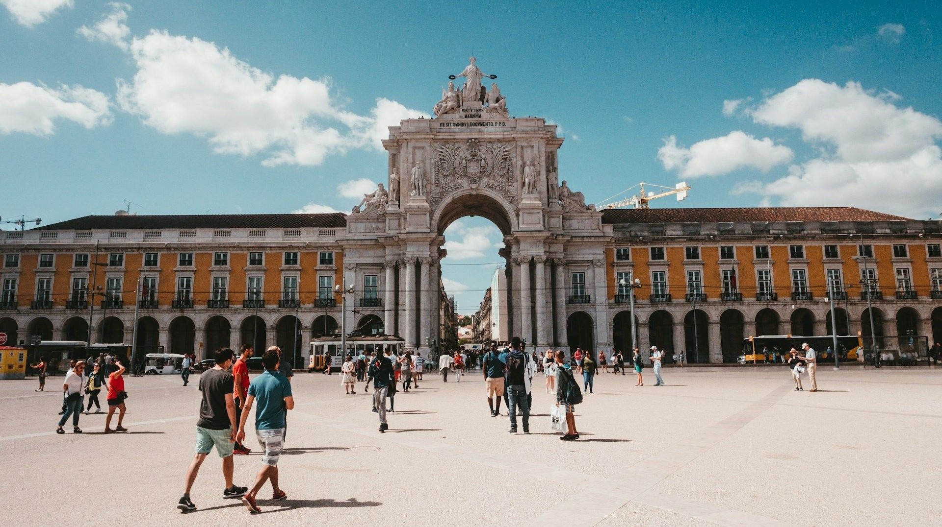 The iconic yellow facade and Triumphal Arch of Praça do Comércio deserves to go on your Instagram story. The arched gate and yellow facade of Lisbon's plaza during 12 days in Portugal