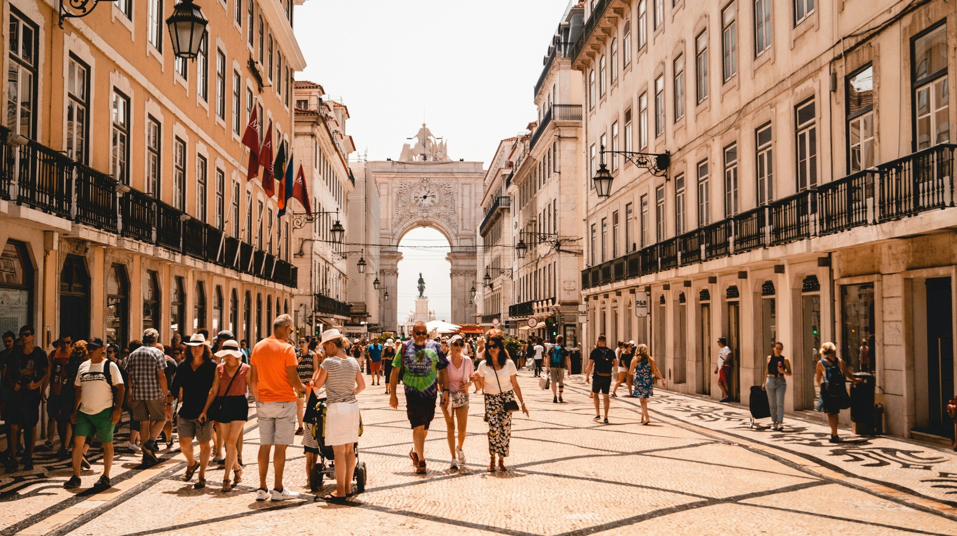 Lisbon's main square, the Praça do Comércio, is known for its magnificent 18th-century arcades, iconic yellow buildings, and intricate mosaic pathways. Walk the streets of Praça do Comércio in Lisbon during 6 days in Portugal