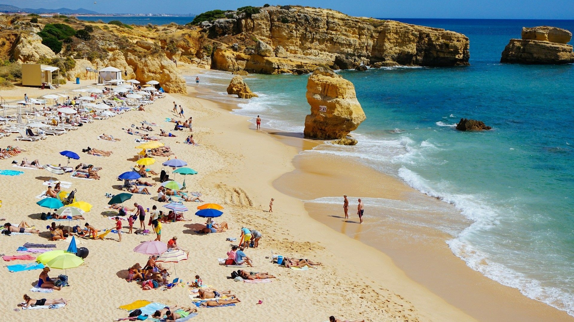 The Algarve region is home to some of the best beaches in Europe. People enjoying the beach in Albufeira in Portugal during 9 days' stay