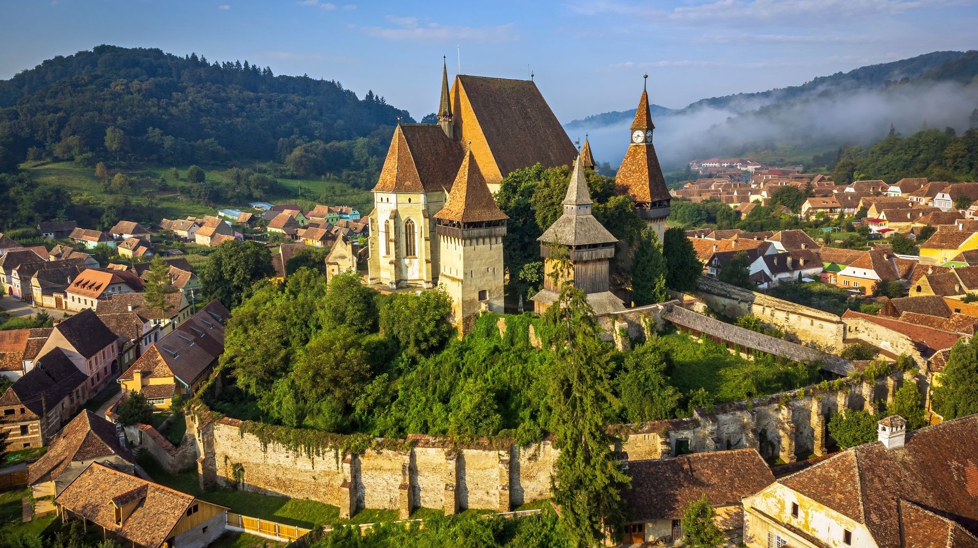 The fortified church in Biertan is perched on top of a hill and surrounded by 35-foot-high defensive walls. A fortified church in Romanian village of Biertan during 5 days' stay