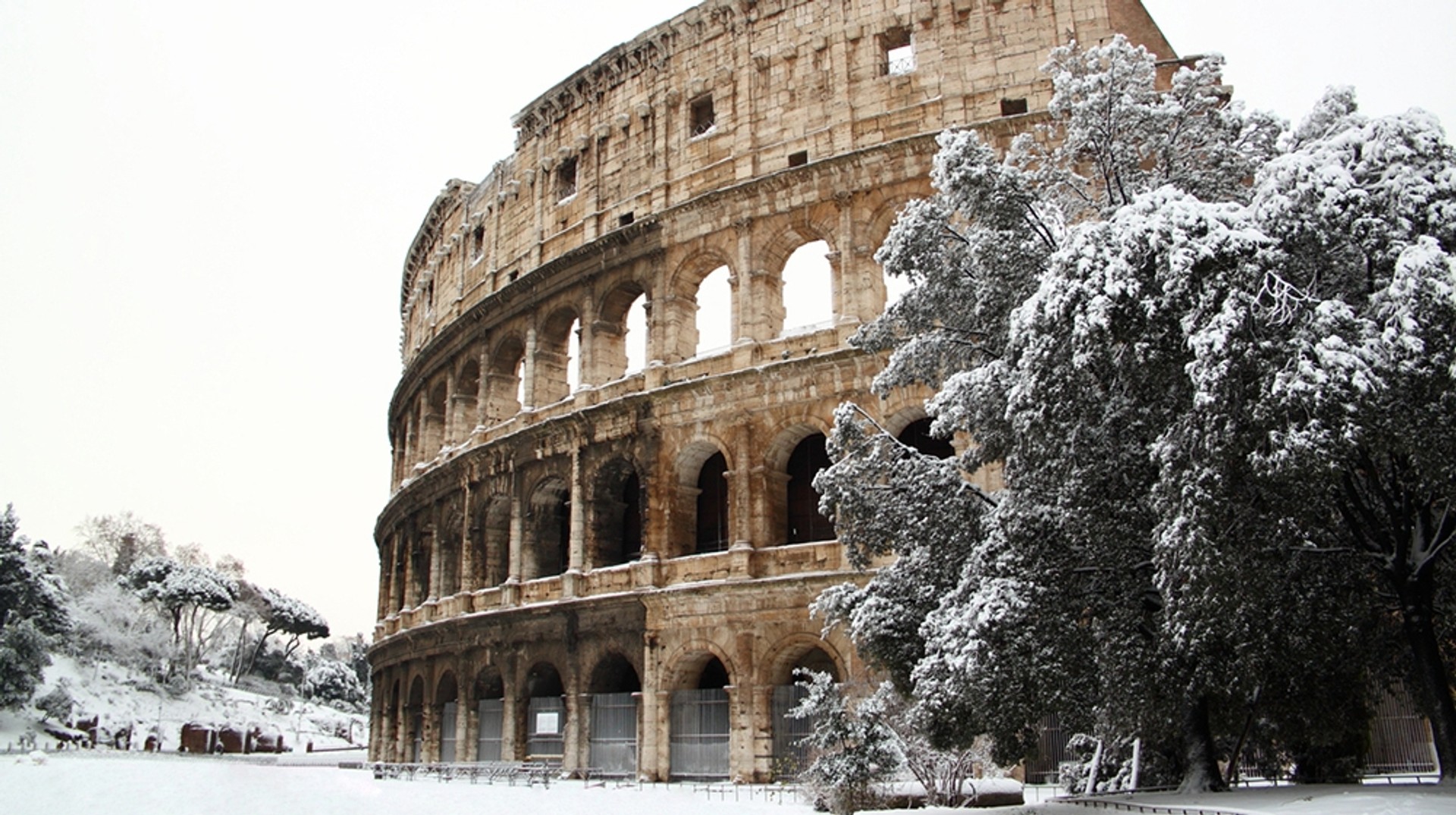 Snow settles on The Colosseum in Rome, Italy Rome in winter can be incredibly rewarding to visit. The cultural sights, lack of crowds, vibrant café and bar scene, and mild climate makes it an ideal winter visit