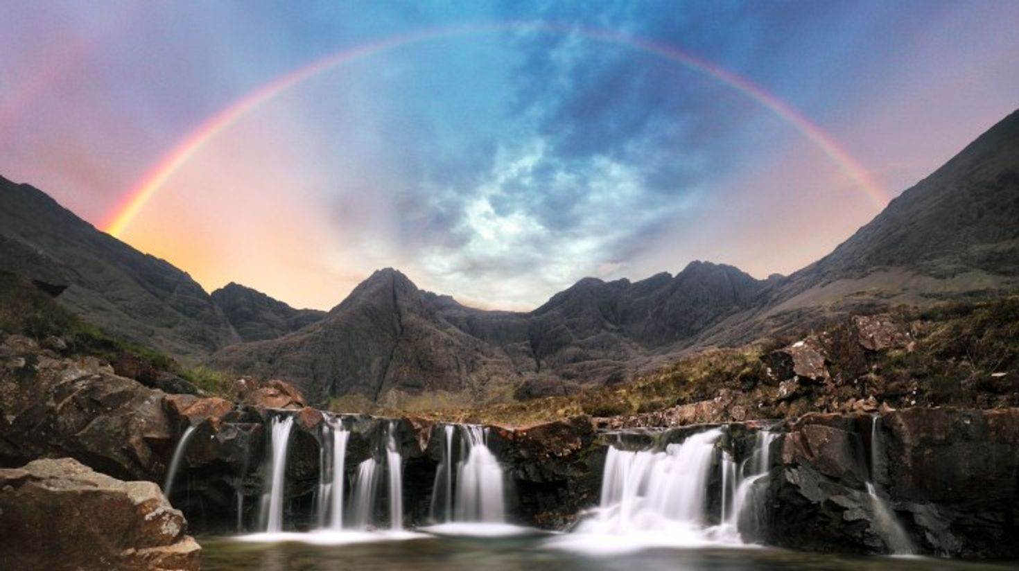 Splash around the Fairy pools in Skye during your 10 days in Scotland.