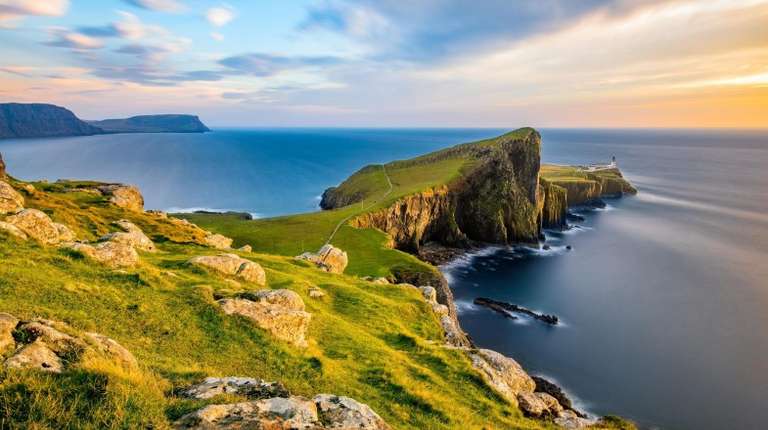 Watch a stunning sunset from the Neist Point during your 4 days in Scotland