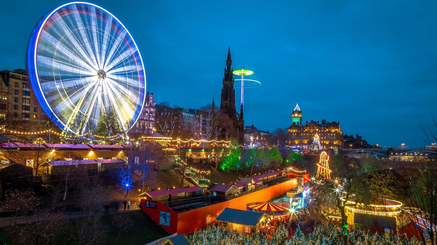 Visit the Christmas market in Edinburgh while touring Scotland in December.