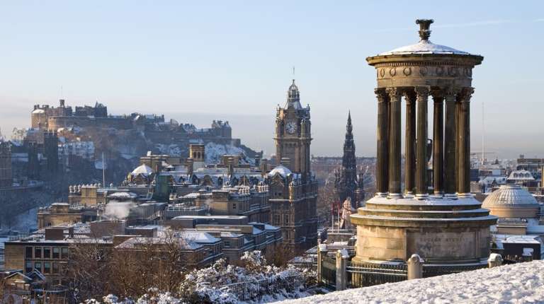 Watch castles in Edinburgh covered in snow in Scotland in December.