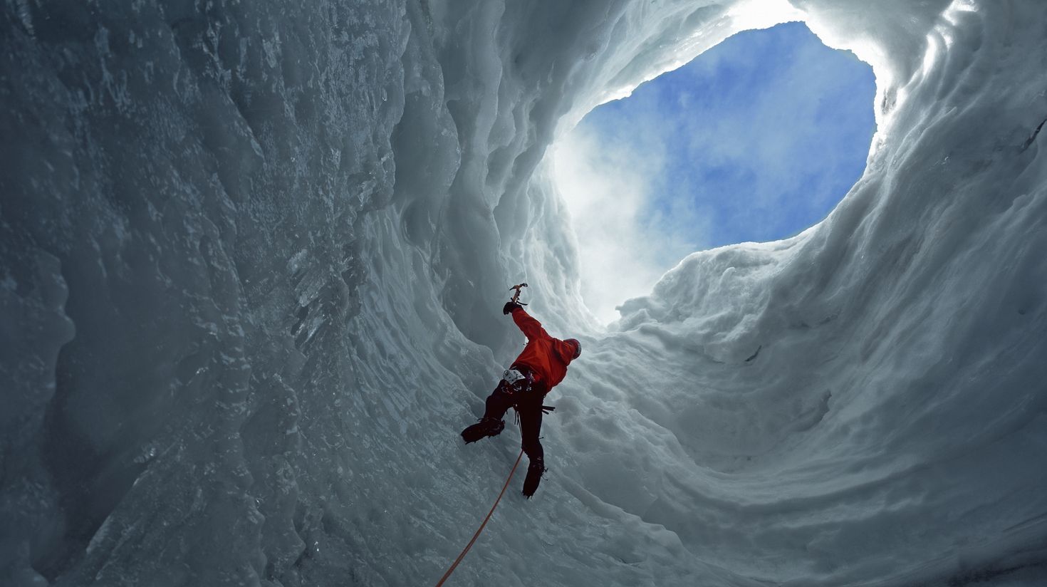 Man climbing Solheimajokull glacier in Iceland